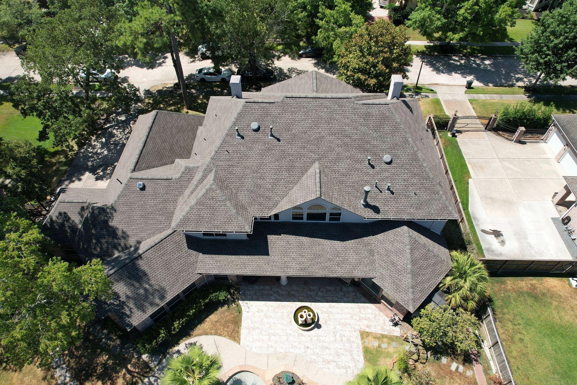 Roof system diagram showing decking, underlayment, flashing, shingles, and ventilation components