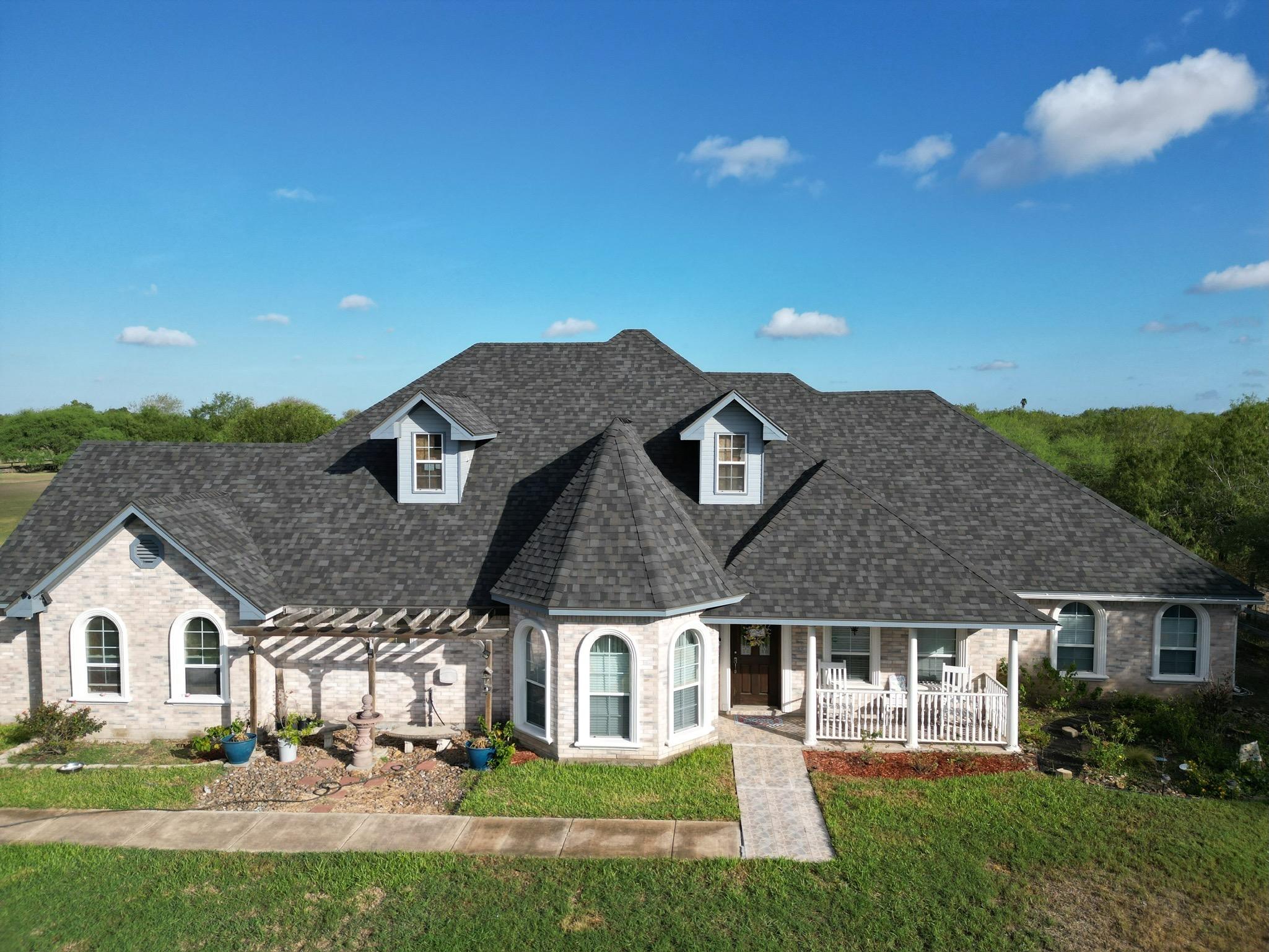 Homeowner praising XYZ Roofing’s long-term reliability and 13-year track record.