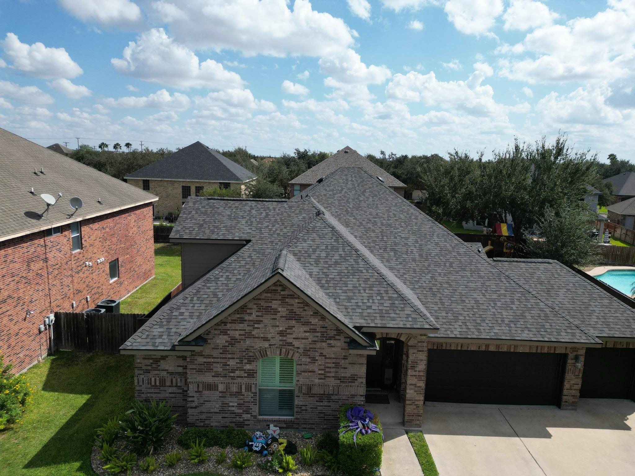Standing seam metal roof with vertical panels on modern home.
